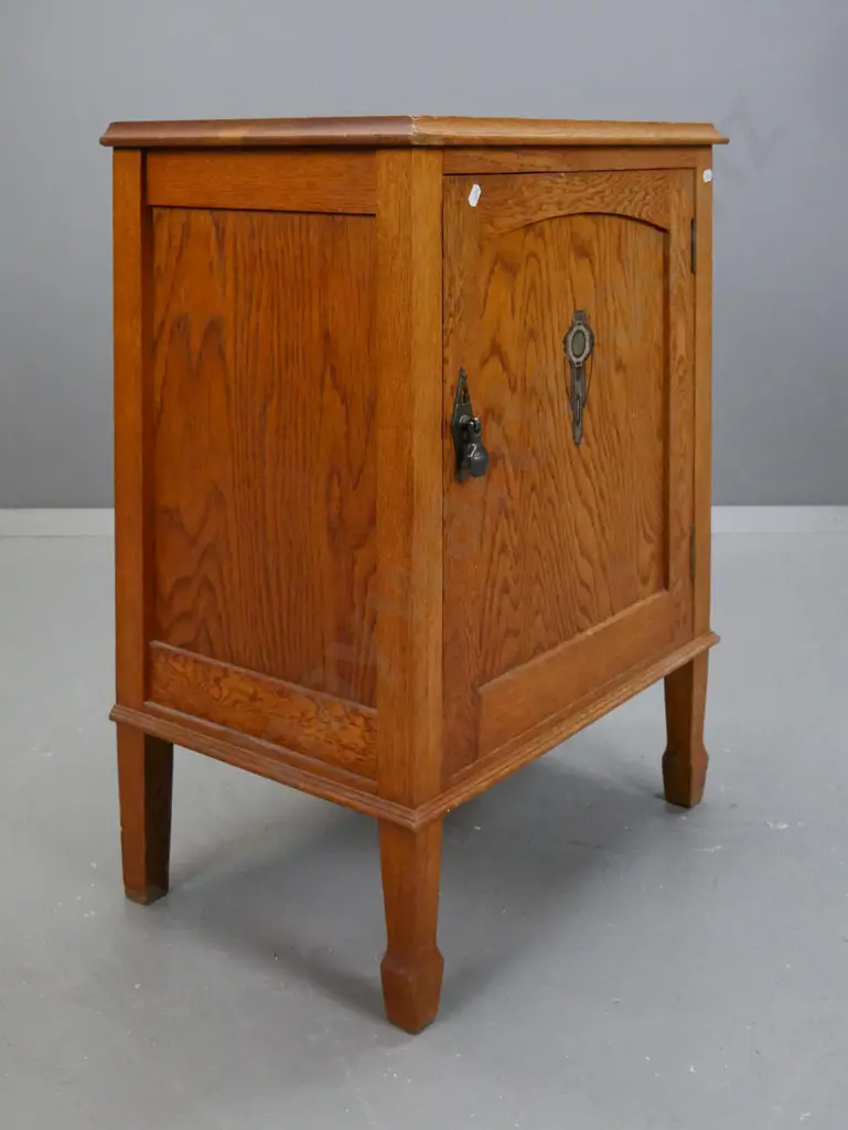 vintage arts & crafts style oak bedside cupboard with panelled door with transfer decoration, drop handle with diamond Image 1++