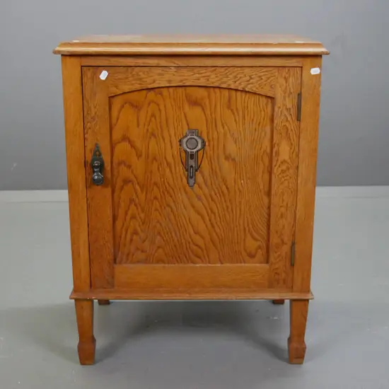 vintage arts & crafts style oak bedside cupboard with panelled door with transfer decoration, drop handle with diamond