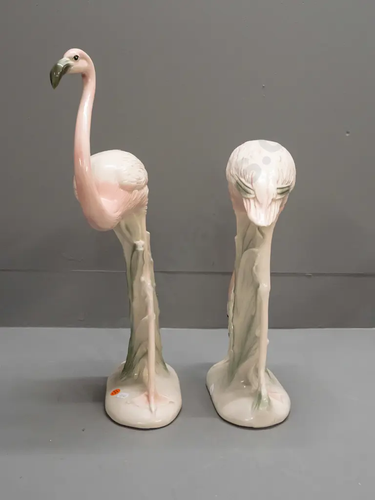 pair of pink flamingo figures, no maker's marks, one with head down has manufacturing crack to leg and 2 small chips. Image 1++