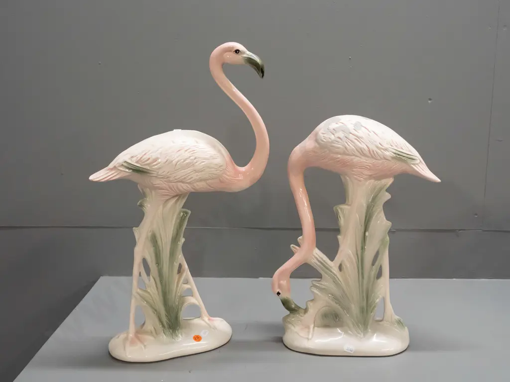 pair of pink flamingo figures, no maker's marks, one with head down has manufacturing crack to leg and 2 small chips. Image 1++