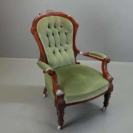 Victorian walnut open-arm gent's chair with carved shaped back, turned fluted legs, deep button back, porcelain & brass