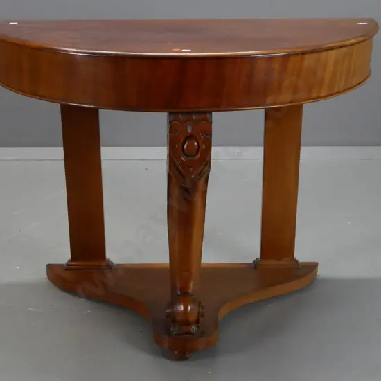Victorian mahogany half round console table with cross-banded veneer front, central sweeping carved leg, platform base -