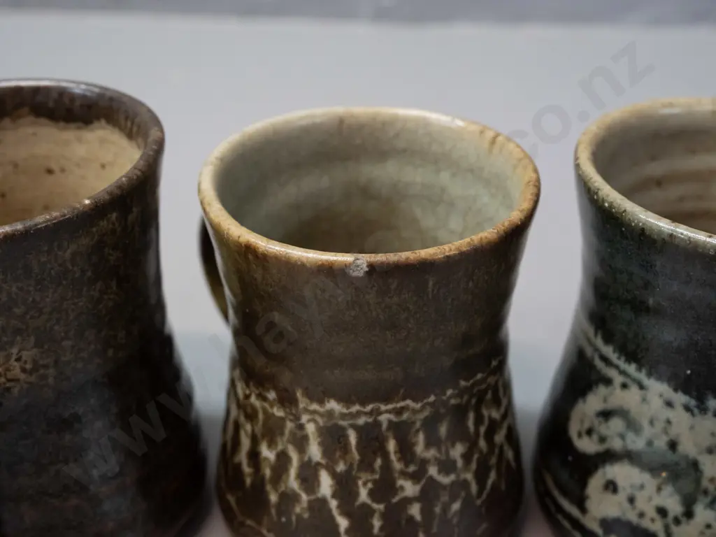 3 Mirek Smíšek New Zealand studio pottery mugs with sunflower maker's mark below handle - 3 colours, one has minor chip Image 1++