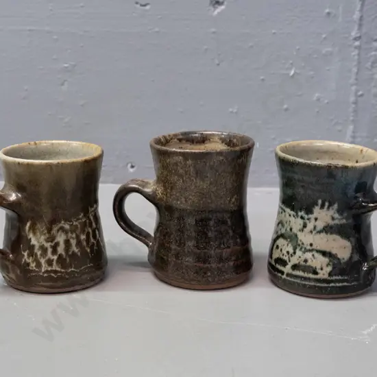 3 Mirek Smíšek New Zealand studio pottery mugs with sunflower maker's mark below handle - 3 colours, one has minor chip