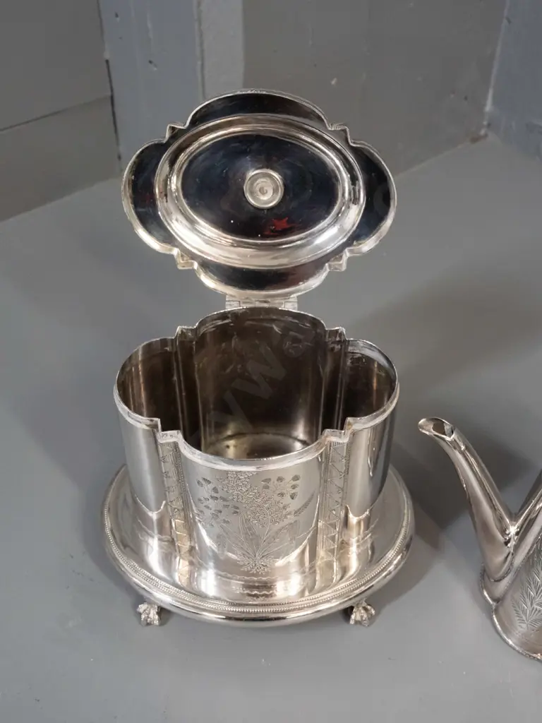 ornately etched plated ware - teapot with bakelite or plastic knob, scalloped body and a hinged lid canister with base Image 1++