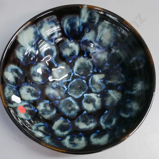 NZ studio pottery flared bowl, marked to base Riki Julin, glazed in blues & browns. H-85 D-255