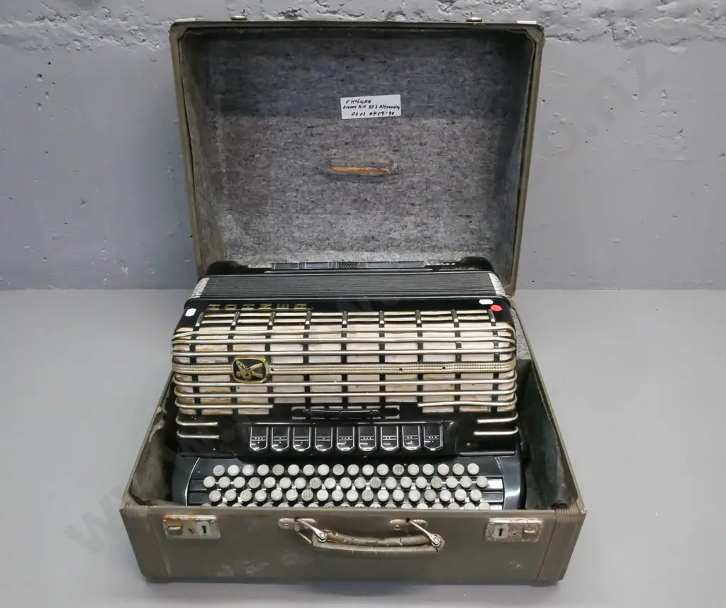 cased Hohner Atlanta 145 button accordion. Strap is worn & cracked, overall wear, discolouration to grille fabric, Image 1++