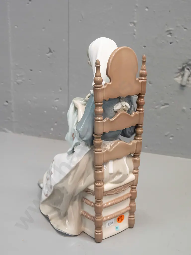 Lladro figure - woman with needlework seated in chair H-280 L-210 front to back Image 1++
