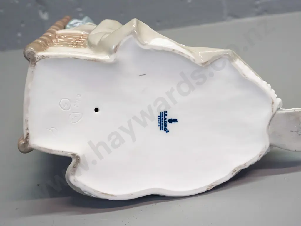 Lladro figure - woman with needlework seated in chair H-280 L-210 front to back Image 1++