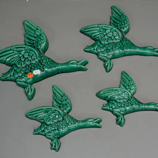 graduated set of 4 green-glazed flying ducks, no maker's marks, majolica style glaze - largest one has minor firing