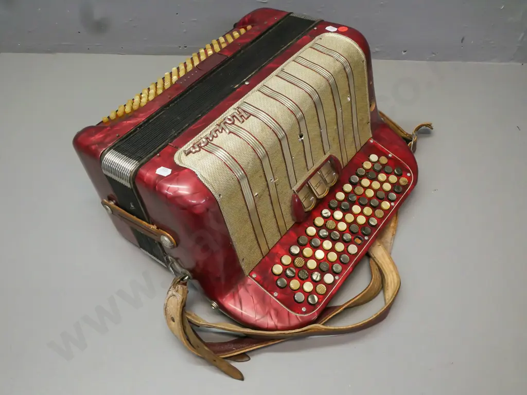 cased Hohner Maestro II button accordion, has one missing button. Wear to leather strap, overall wear and some corrosion Image 1++