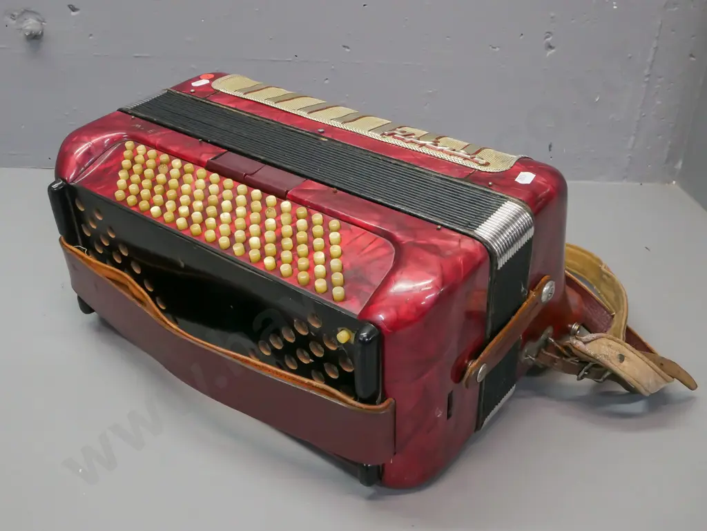 cased Hohner Maestro II button accordion, has one missing button. Wear to leather strap, overall wear and some corrosion Image 1++