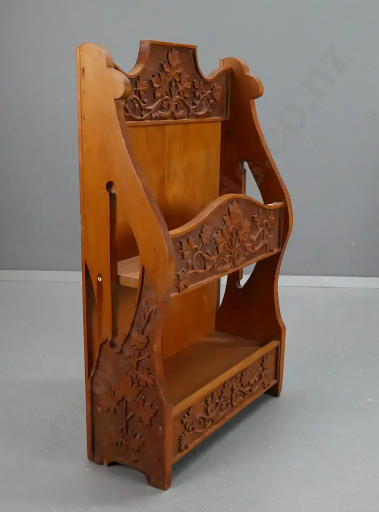 vintage kauri and rimu shelf unit with foliate and grape motif chip-carved panels, pierced sides - some chips to bottom Image 1++