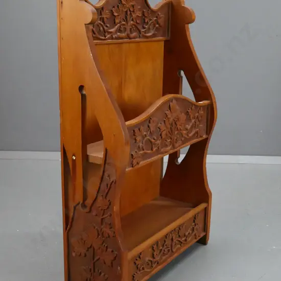 vintage kauri and rimu shelf unit with foliate and grape motif chip-carved panels, pierced sides - some chips to bottom