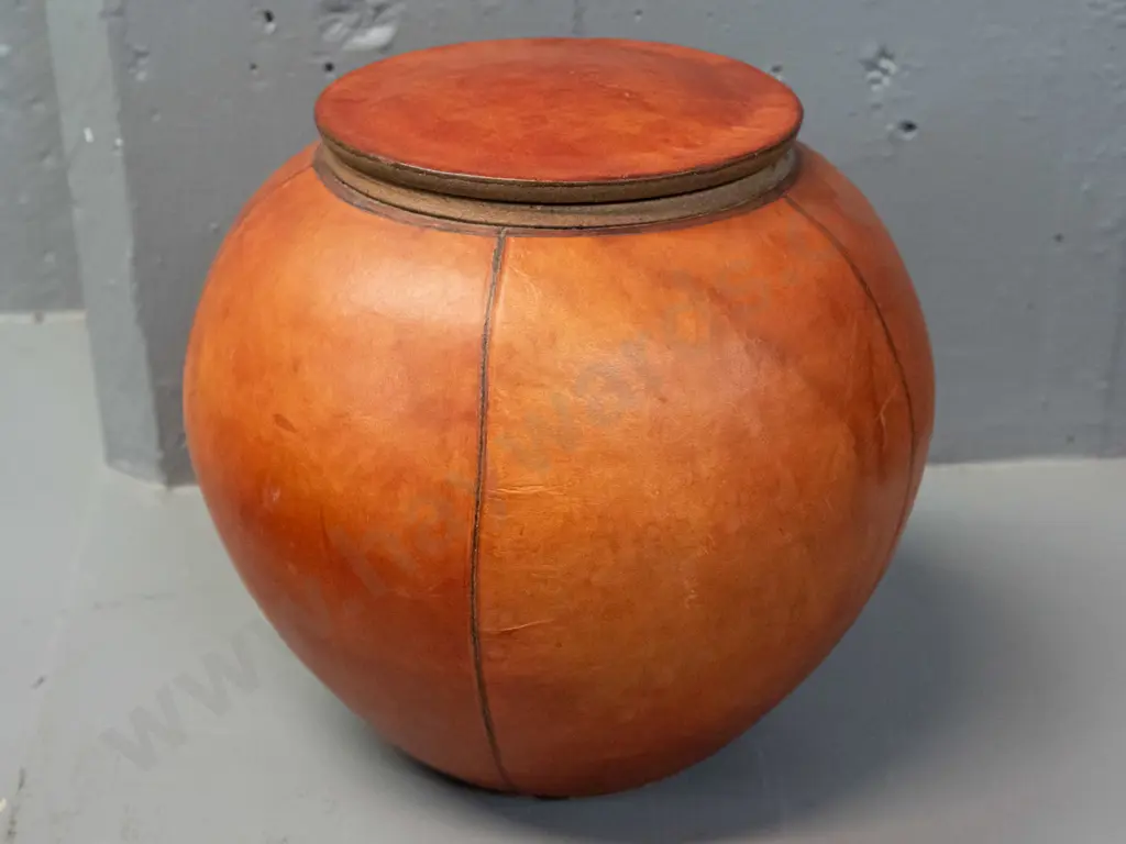 lidded studio pottery pot with leather covering - has break through pottery layer of lid H-200 D-200 - label for B.N.R. Image 1++