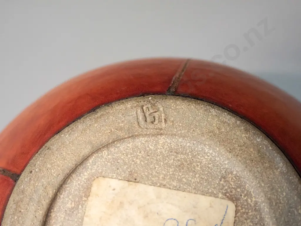 lidded studio pottery pot with leather covering - has break through pottery layer of lid H-200 D-200 - label for B.N.R. Image 1++
