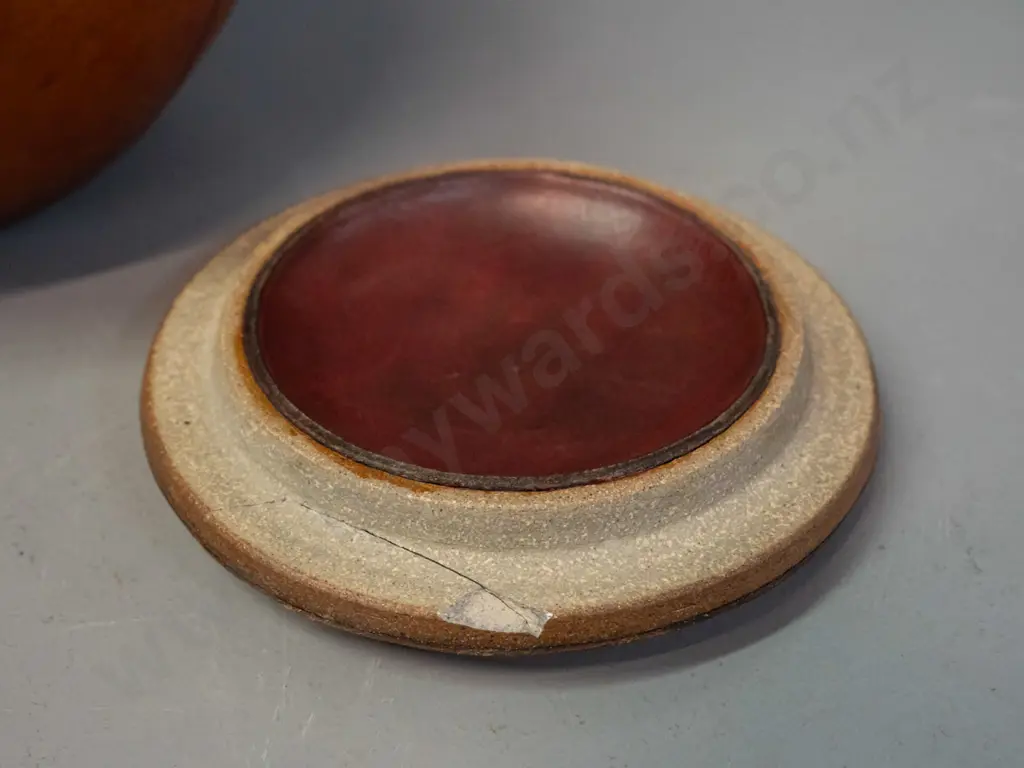 lidded studio pottery pot with leather covering - has break through pottery layer of lid H-200 D-200 - label for B.N.R. Image 1++