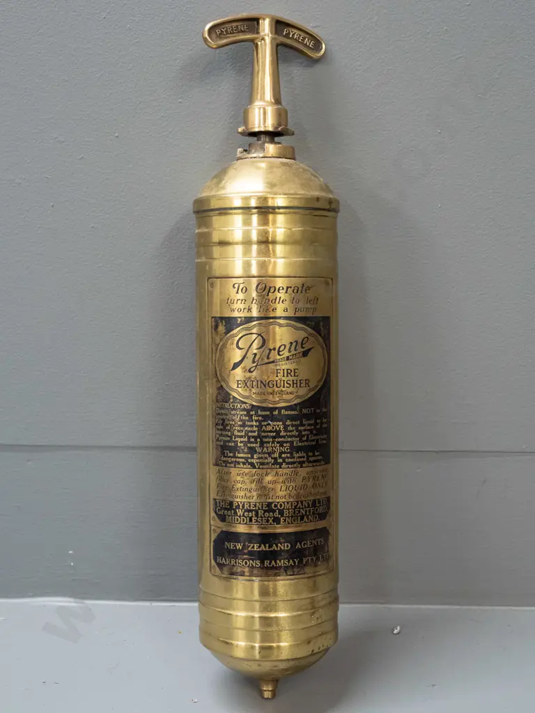 small brass hand-pump fire extinguisher - Pyrene Made in England, w/ Harrison's Ramsay NZ markings - minor denting L370 Image 1++