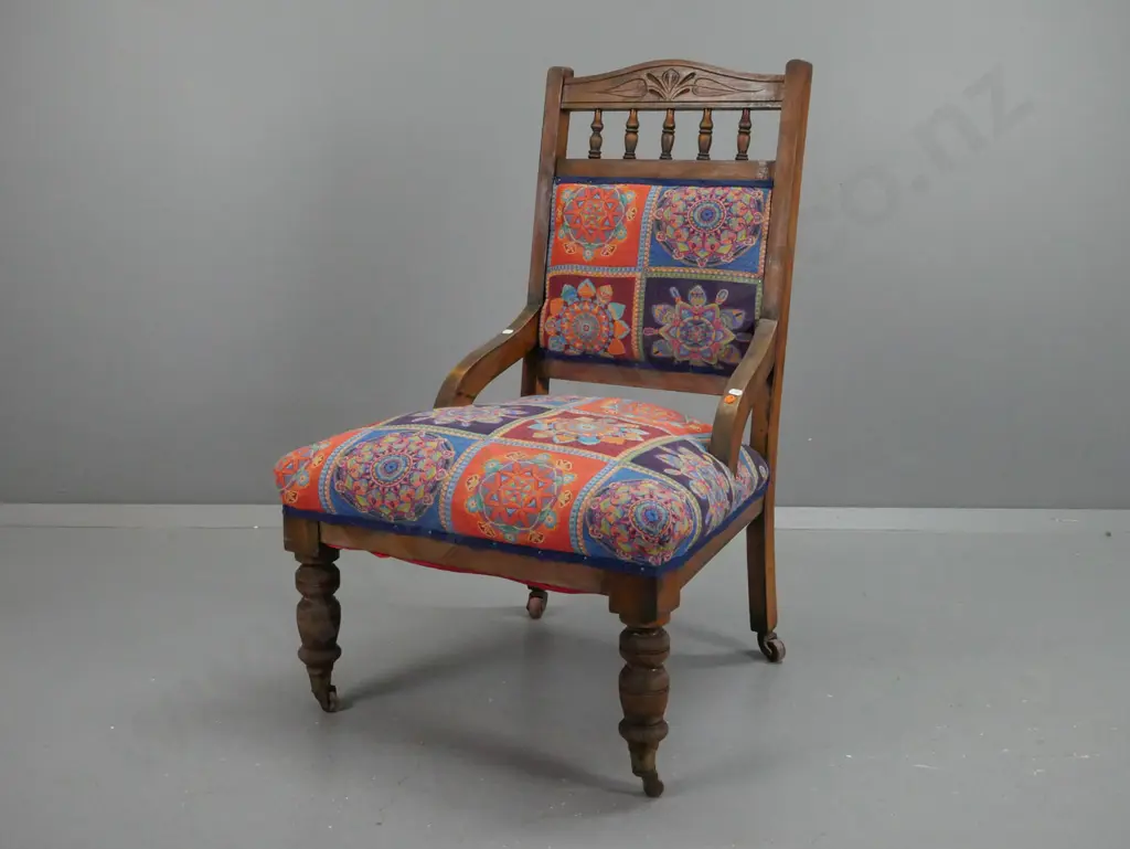 Edwardian beech bedroom chair with carved back rail, turned gallery supports, turned front legs on brass bucket casters Image 1++