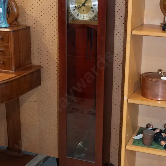 small mahogany long-case chiming clock on cabriolet-foot base, with arched glazed door, wood & brass pendulum, silver