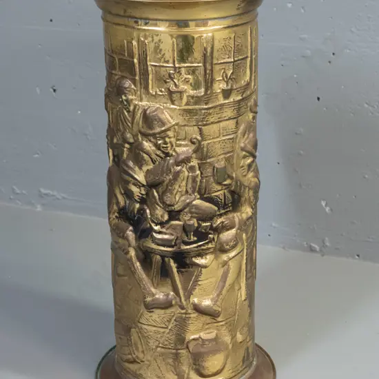 cylindrical pressed brass tavern scene umbrella / stick stand, stamped Lombard England on bottom - some denting and some