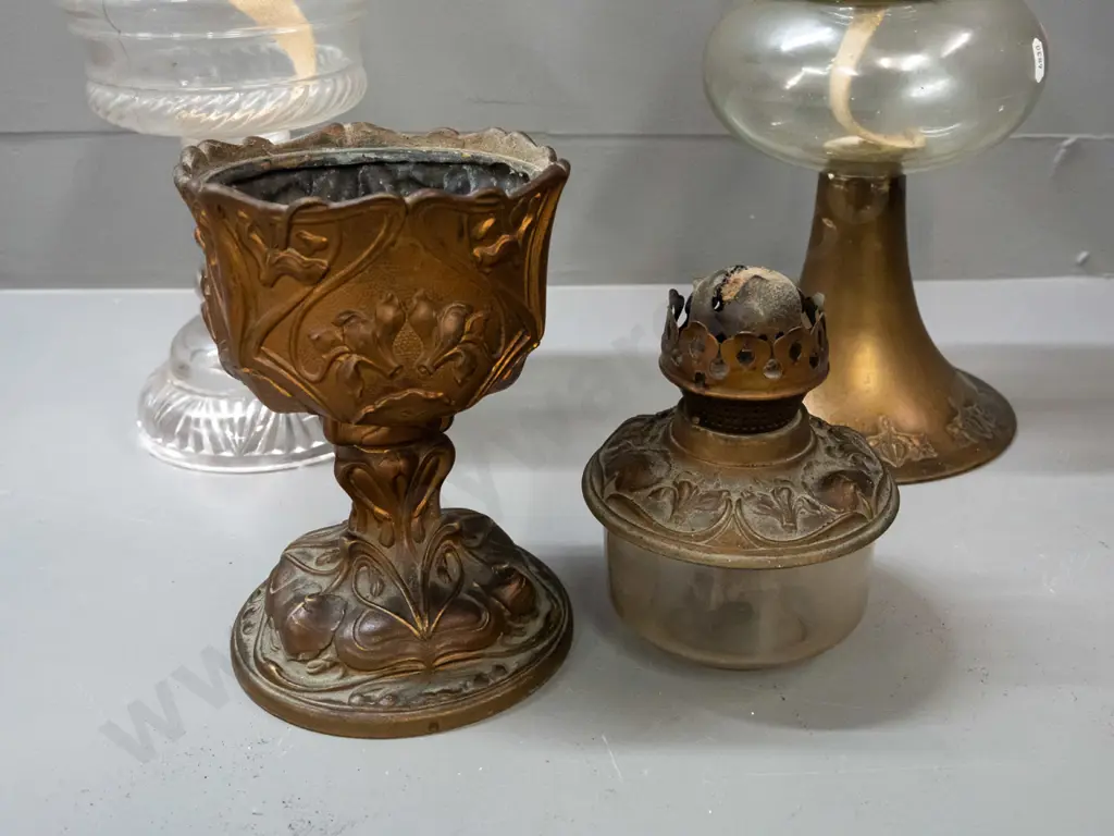 3 vintage kerosene lamps - brass base with nouveau style repeating pattern, clear glass tank & chimney, knob marked Image 1++