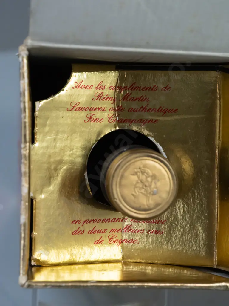 bottle of Remy Martin cognac Fine Champagne VSOP, with "Specially Packed for Singapore Airlines" sticker on bottle. Wear Image 1++