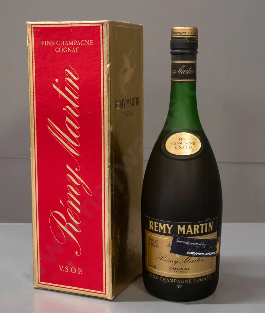 bottle of Remy Martin cognac Fine Champagne VSOP, with "Specially Packed for Singapore Airlines" sticker on bottle. Wear Image 1++