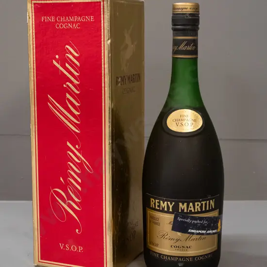 bottle of Remy Martin cognac Fine Champagne VSOP, with "Specially Packed for Singapore Airlines" sticker on bottle. Wear