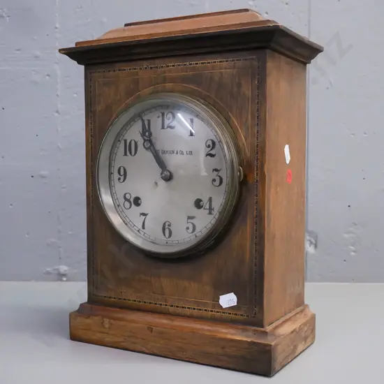 vintage walnut cased mantle clock with ebony and boxwood stringing, brass bezel, domed glass, silvered face w/ Stewart
