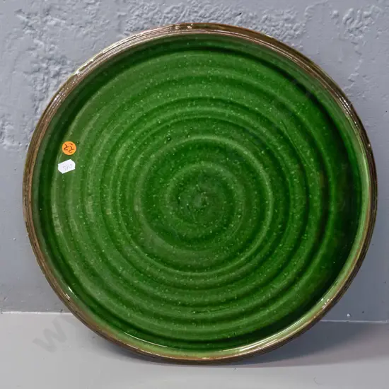 Tony Sly New Zealand studio pottery platter with green swirl pattern - impressed mark on underside - D-360