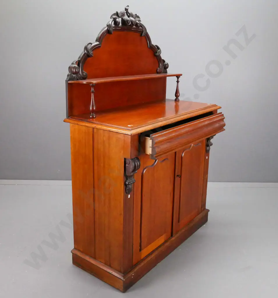 NZ colonial cedar carved-back chiffonier with shaped top shelve, drawer over 2 shield-panelled doors, kauri interior. Image 1++