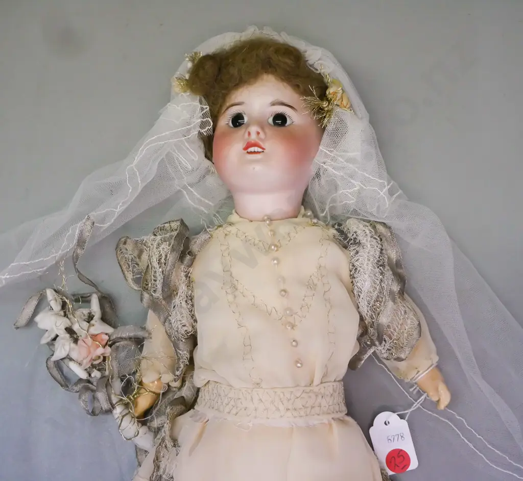 vintage porcelain doll w/ glass eyes in wedding dress, SFBJ Paris, some wear and staining to costume, loose hairpiece. Image 1++