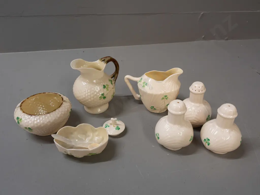 assorted Belleek items - black mark jug H95, bowl and open salt with mother of pearl spoon, green mark jug, 3 condiments Image 1++