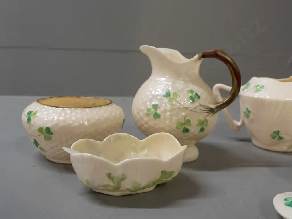 assorted Belleek items - black mark jug H95, bowl and open salt with mother of pearl spoon, green mark jug, 3 condiments Image 1++