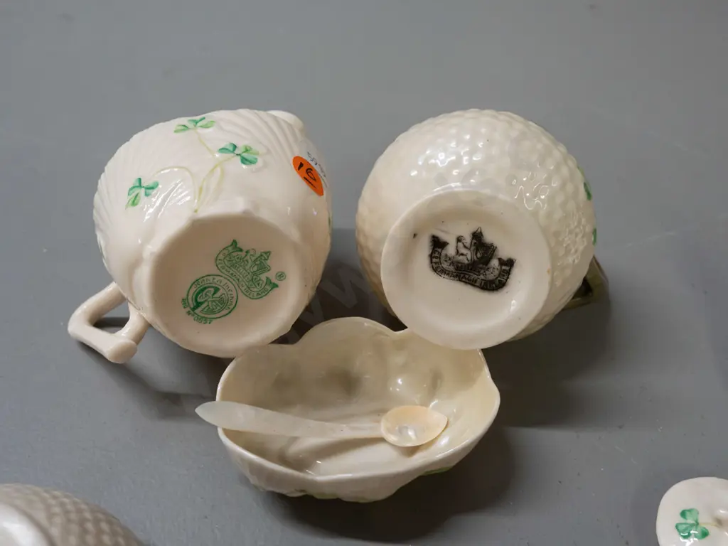 assorted Belleek items - black mark jug H95, bowl and open salt with mother of pearl spoon, green mark jug, 3 condiments Image 1++