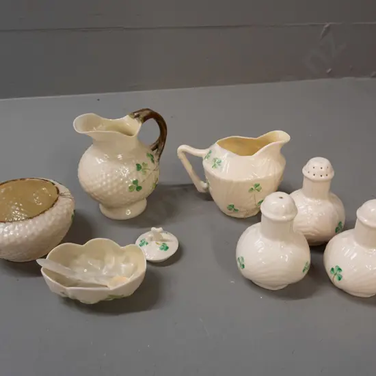 assorted Belleek items - black mark jug H95, bowl and open salt with mother of pearl spoon, green mark jug, 3 condiments