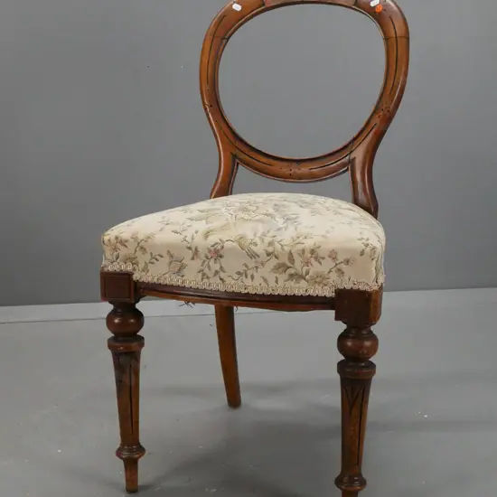 Victorian walnut balloon back side or bedroom chair with turned fluted legs, floral upholstered seat. Loose back,