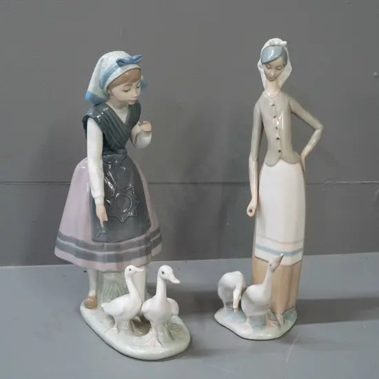 2 Lladro figurines - girls with white ducks - taller one may have had hand-held item of some sort H-280