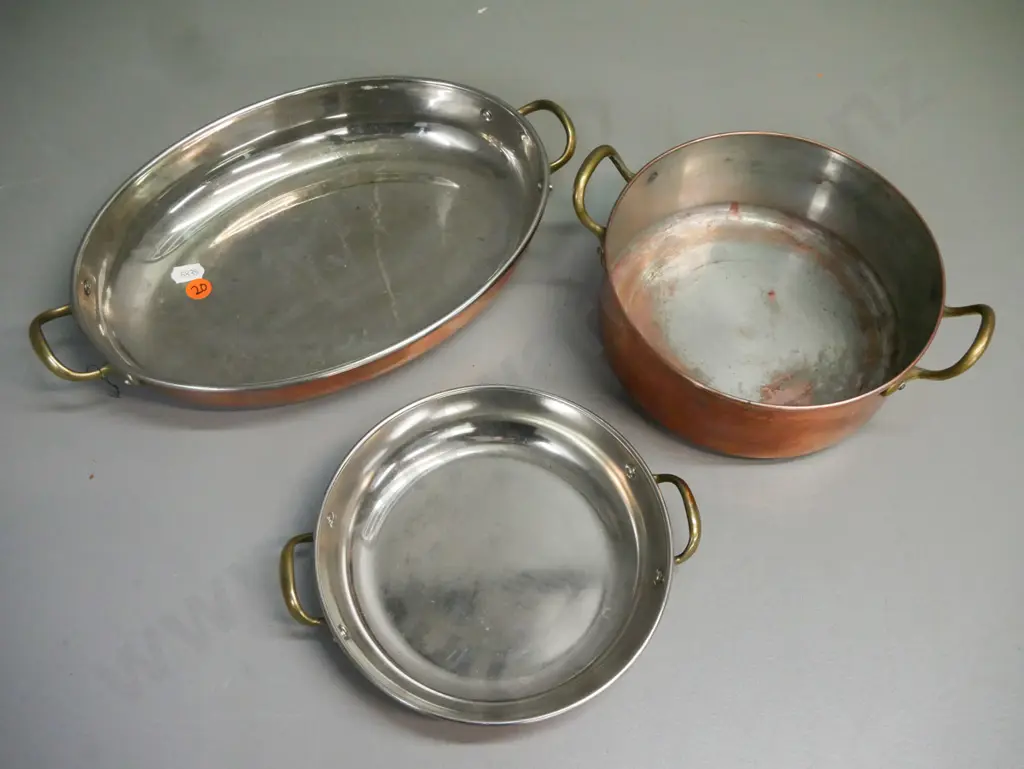 3x double-handled copper pans w/ white metal interior & brass handles. One is well-used: corrosion, scratching etc. Image 1++
