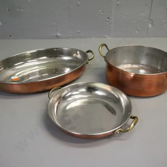 3x double-handled copper pans w/ white metal interior & brass handles. One is well-used: corrosion, scratching etc.