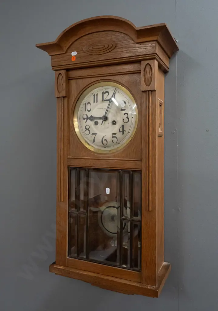 vintage oak-cased chiming wall clock w/ silvered dial marked Stewart Dawson & Co, brass bezel. Bevelled leadlight door, Image 1++