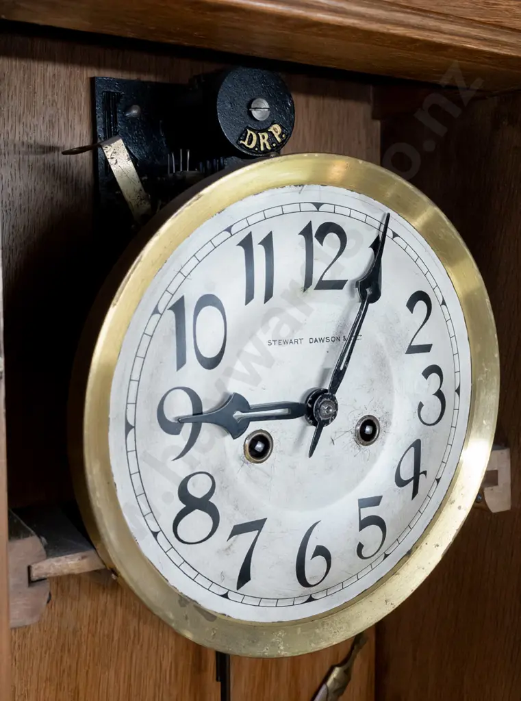 vintage oak-cased chiming wall clock w/ silvered dial marked Stewart Dawson & Co, brass bezel. Bevelled leadlight door, Image 1++