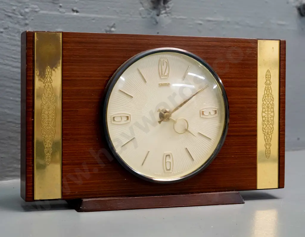 retro Smiths mantel clock with mahogany base, teak veneer and etched brass strapping, plastic-cased C battery movement. Image 1++