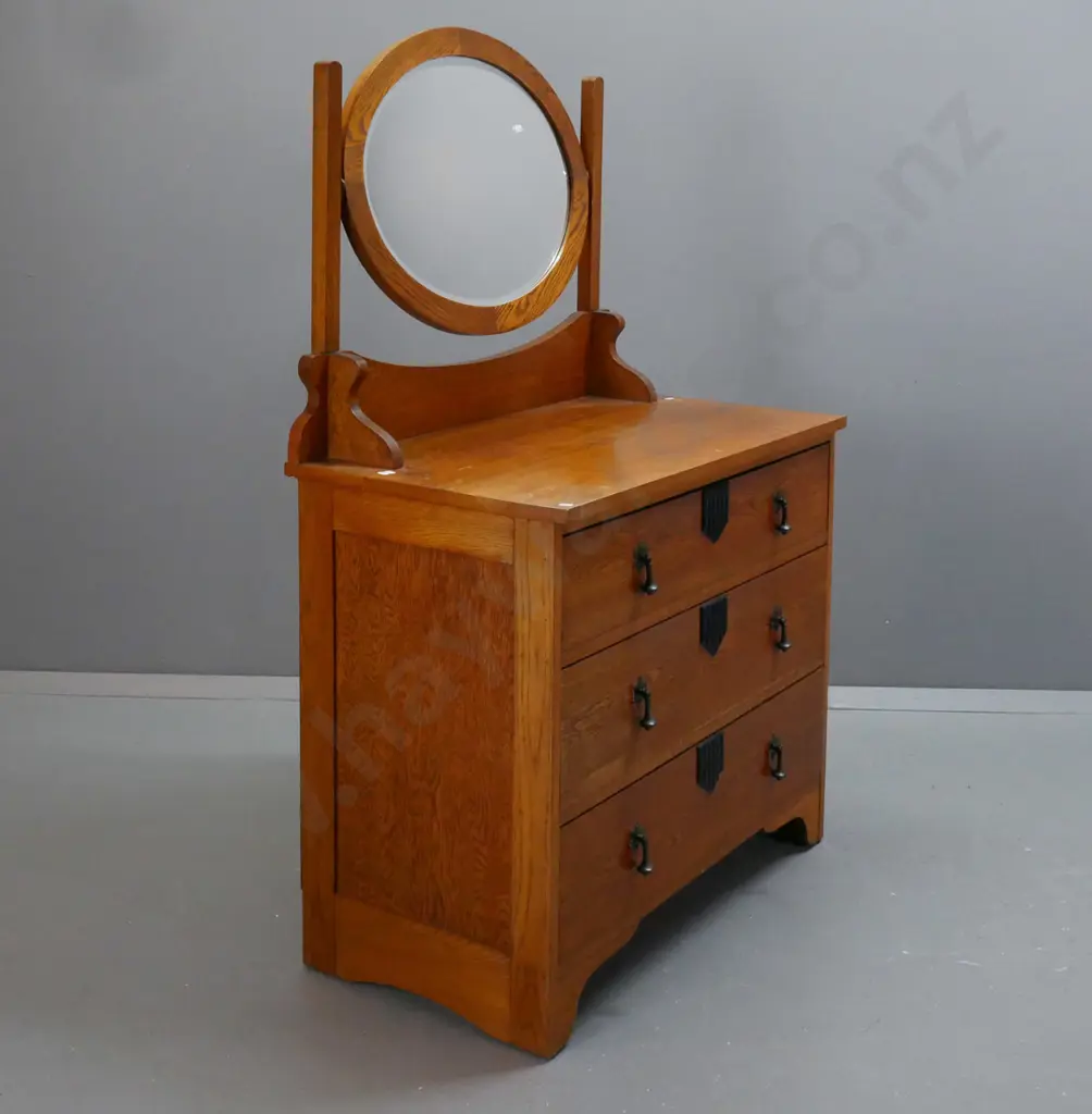 oak Art Deco-style dresser w/ oval bevel-edged mirror above 3 long drawers w/ metal drop handles, fluted ebonised Image 1++