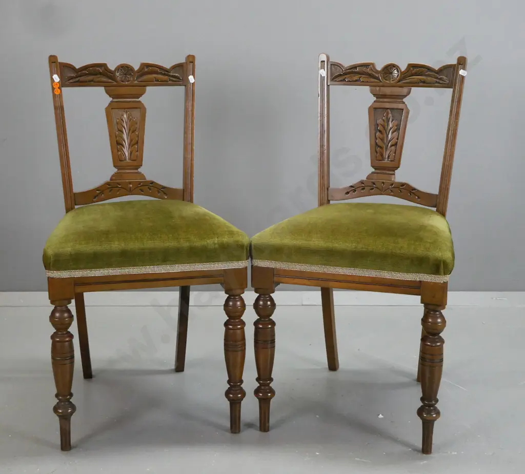 pair Edwardian beech side chairs with foliate carved crest rail and back splat, turned front legs, green velvet Image 1++