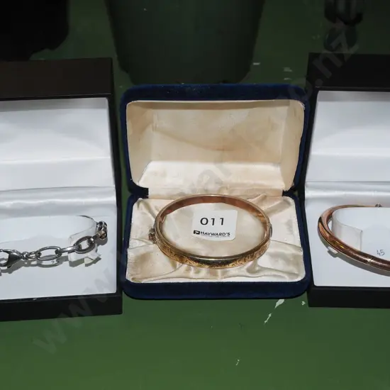 2 cased bangles and a cased bracelet
