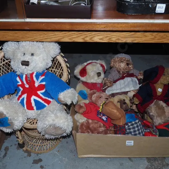 box of teddy bears and a bear in a cane chair