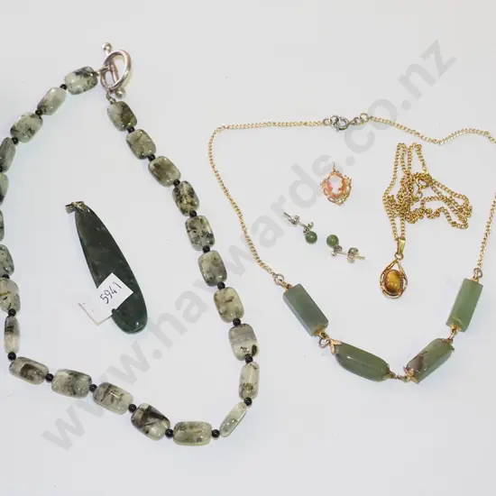 plastic tray; green stone pendants, greenstone necklaces, cameo pendant etc
