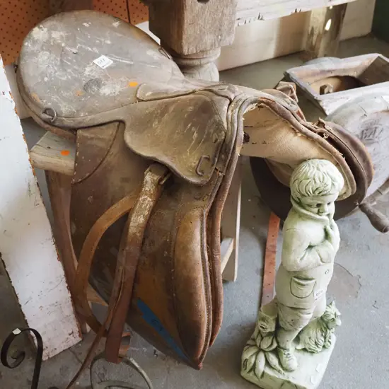 old saddle, wooden stool - orange dots